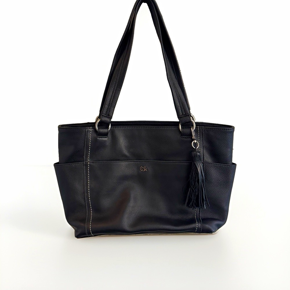 The Sak Black Pebbled Tote Bag w/ Tassel Accents, Outer Pockets, Silver HW